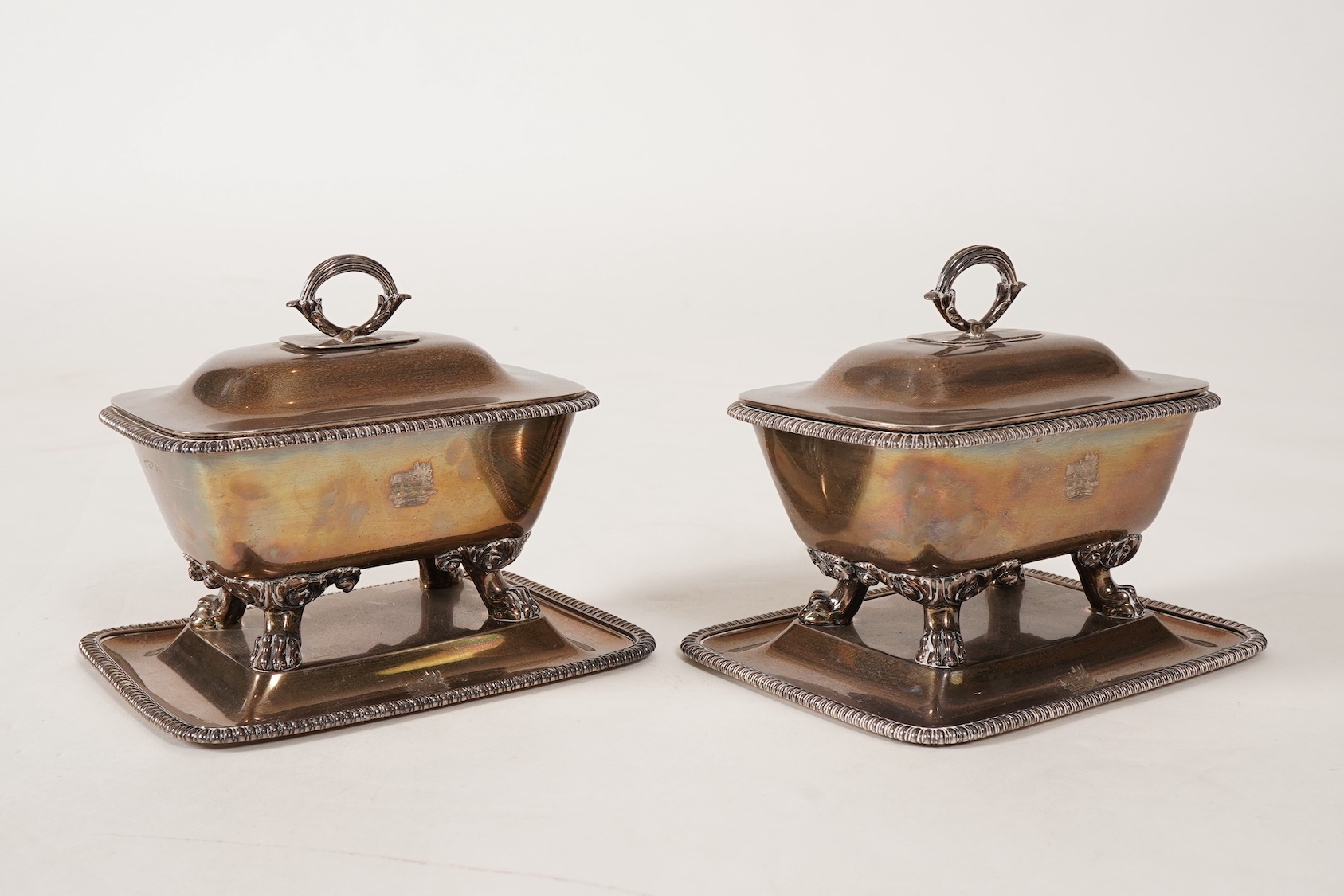 A pair of George IV silver sauce tureens with covers and integral stands, by Philip Rundell